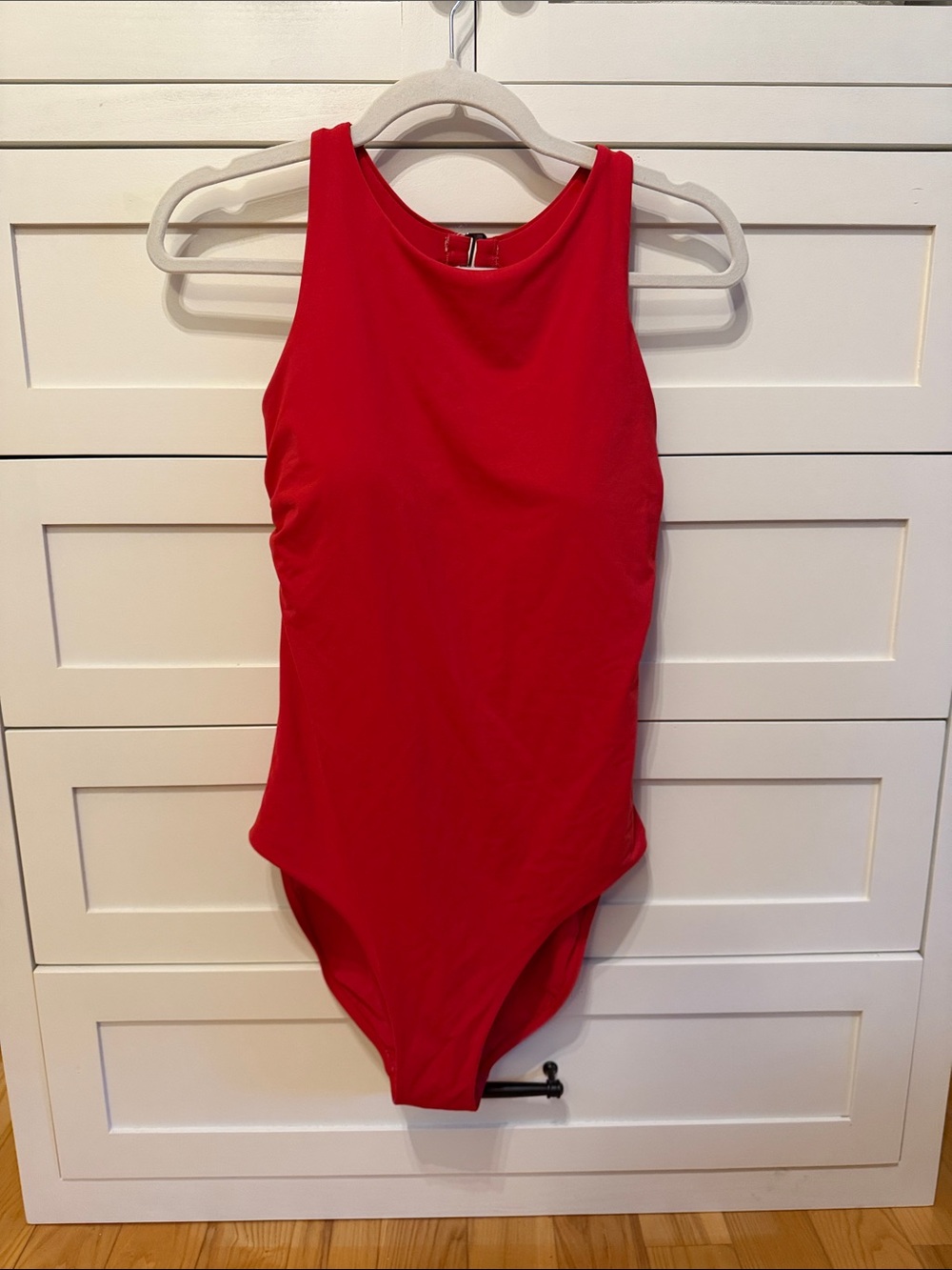 Red one piece. Medium tall